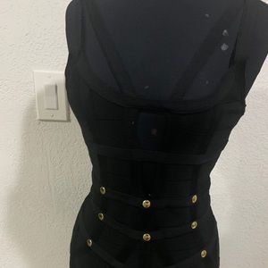 Bebe (L) Black and gold bandage dress